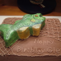 Fish Birthday Cake Oreo cake with a yellow fish cake on top. Fish is covered in fondant. The rest of the cake is buttercream.