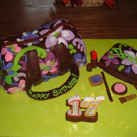 Pattern Inspired By "purple Punch" Vera Bradley Purse and smaller make-up bag covered in chocolate marshmallow fondant with flowers and accents in colored marshmallow fondant.