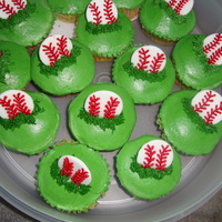 Baseball Cupcakes Buttercream icing with fondant baseballs.