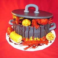 Crawfish Boil 3 choc fudge cake, choc icing covered in mmf, corn and potatoes made with rct covered in mmf, lemons and crawfish made of mmf