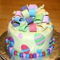 Happy Easter I made this cake for a charity auction for the school I teach at. It is chocolate WASC with peanut butter filling and is covered with MMF....