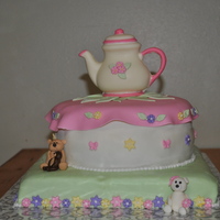 Teddy Bear Tea Party This cake was for a teddy bear tea party. It has a solid chocolate tea pot and fondant teddy bears on it.