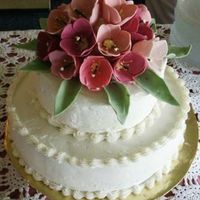 Tulips On Top This was actually a lady's 70th birthday cake, but I felt it was more appropriate as a wedding cake because my inspiration was all...