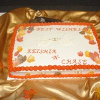 Fall Themed Shower White cake with buttercream icing with fondant leaves.