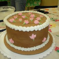Final Course 1 This is my final for Wilton Course 1. It's chocolate cake with coffee frosting and sweet peas in buttercream. It was delicious. I am...