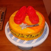 Wizard Of Oz Cake I made this cake for a friend's wife's birthday. I made the ruby slippers out of gumpaste and covered them in fondant. I also...
