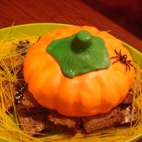 Pumkin Cake This was the first cake I ever did that was covered in fondant. I used a basic bundt cake and shaped the stem. I loved it!
