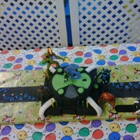 Omnitrix My Granddarlin' , Jackson's 6th birthday. He wanted a Ben 10 cake to put his toys on. I wanted to do the figures in gumpaste, but...