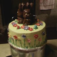 0411092140_0001.jpg Lime green buttercream with gumpaste flowers and store bought chocolate bunnies.