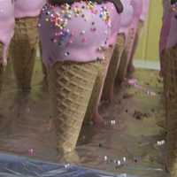 Ice Cream Cone Sundaes -Cake Pops Chocolate cake balls dipped into pink candy coating and put onto sugar cones.
