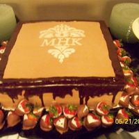 Chocolate With Damask Emblem This is a chocolate cake with chocolate buttercream icing. This was actually done for the rehersal dinner. The wedding used the damask...
