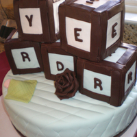 Baby Shower Blocks This is a cake I did for my niece... The bottom is coconut cake with pineapple curd & the blocks are chocolate chip cake with ganache....