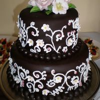 Ashley's Bridal Shower Cake This is my first real stacked cake that I actually sold! It is a chocolate cake with coffee buttercream & covered in dark chocolate...