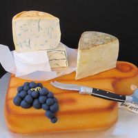 Cheese Board Cake Inspired by the Maher Sisters of Chicago. Board and Cheese Cakes covered in Fondant. Grapes rolled out of fondant. Knife and Rat out of...