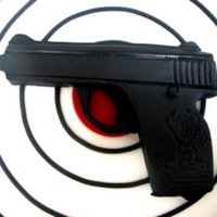 Gumpaste Gun Gun done in gumpaste for groom's cake. I am not posting the whole cake because I only did the gun. The little devil was a custom...