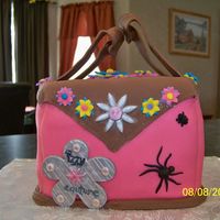 Dress Up Purse Purse cake for the 7th birthday of a little girl who is a little bit girly-girl and a little bit tom-boy hence the bugs). White cake with...