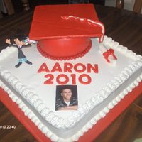 Graduation Cake I'm very new with fondant. I made the cap with the help from others on this site.It's buttercream and MMF. Humidity was really...