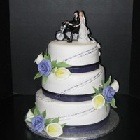 Motor Cycle Wedding Cake Motorcycle wedding cake, hand painted tracks to the top of the cake, flowers are gumpaste