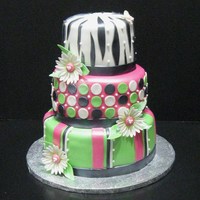 Fun Wedding Cake Fun Wedding cake for a fun bride, 6-8-10 inch round, covered in fondant with fondant accents, leaves and daisies are gum paste.. The entire...