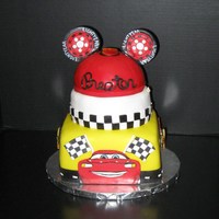 Mickey Mouse Cars Cake Mickey mouse Cars cake, 8 inch square, 7 inch round and 6 inch half ball cake.ears, lighting and lightning Mcqueen are made out of gum...