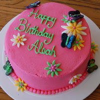 Flowers & Butterfly Cake Cake I made for my niece's 3rd birthday. She requested a pink cake with flowers and butterflies. Buttercream iced with fondant accents...
