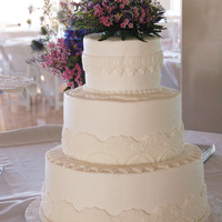Lace Wedding Cake 14", 10" & 6" rounds. Iced in buttercream. I used buttercream fondant in lace molds. Piped a simple shell border around...