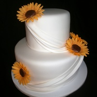 Sunflowers & Drapes Sunflowers are made of gumpaste and I used the fondant flower center mold for the centers. :) Thanks for looking!