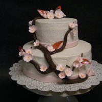 Wilton Course 3-- Final Cake Cake is French Vanilla with a whipped chocolate ganache frosting. Almond buttercream outside. Flowers and leaves are gumpaste and hand...