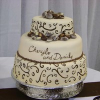 Belgium Chocolates On Fondant This is a wedding cake that I made for a friend of mine. MFF painted with brown Wilton's gel color thinned with clear vanilla,...