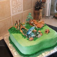 Fishing Birthday Cake made for grandson who loves fishing. Cinnamon roll cake with buttercream. All decorations done in gumpaste and fondant.
