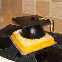 High School Graduation Made for a high school graduation. Cake is yellow cake with ganache filling and fondant, fondant top. Bottom is yellow cake with ganache...