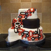 Paisley Wedding Cake The cake was totally designed by the bride. Chocolate cake with ganache. Center layer, white cake with white ganache. Covered in fondant.