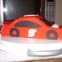 Racecar Birthday Cake A racecar birthday cake I made for my boyfriend's grandma. Fondant covered cake with fondant decorations applied. She thought it was...