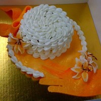 Hat And Glove this was actually an easter cake a father gave to his daughter and grand-daughter; brim, glove and bow made of fondant; buttercream cap;...