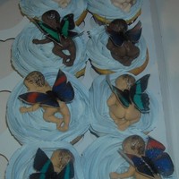 Baby Butterflies - Cupcakes Cupcakes were made for a baby shower at work. Babies are made of white, dark and peanut butter chocolate. Butterflies are made of rice...