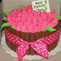 Barrel Of Roses This is an 8' cream cheese almond cake with fresh strawberry filling. The roses are mmf and kit kats around the cake. TFL.