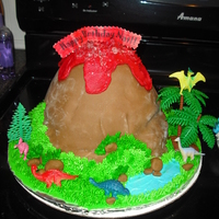 Volcano Cake This was a very simple volcano cake done for a friend on a budget. I used the wilton doll cake mold and one 8 or 9 inch round filled and...