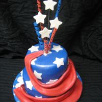 4Th Of July Cake This is a two tiered cake covered in blue fondant with white stars. I made the top stars and curly q's from gumpaste and attached them...