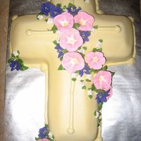 Floral Cross This cake was done following the instructions on Wilton.com. I actually made it for a baptism. It is covered in fondant and the flowers are...