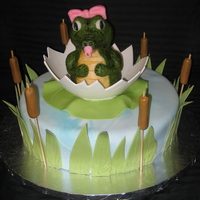 Baby Gator Cake The baby gator was sculpted out of rice crispy treats then covered in modeling chocolate. The egg, lilly pad, grass, and cattails are made...