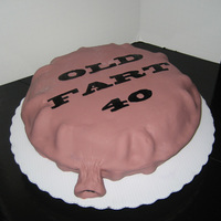 Whoopie Cushion Cake A big thanks to Mooj for the funny, funny idea. I made this for a 40th birthday party. Used two 10" rounds carved into a pillow. Used...