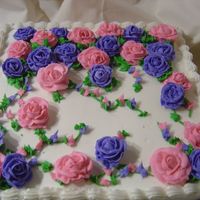 Rose Garden Cake this was a last minute cake for my mothers boss; she wanted a garden theme with roses. This is a buttercream vanilla white cake with...