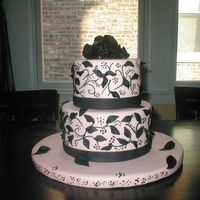 Pb_Cake.jpg I made this cake for a client who is going to renew her vows.The cake is made of chocolate/vanilla cake w/ chocolate ganache. All...