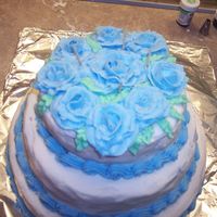 100_1088.jpg My first attempt at buttercream roses. Just a practice cake I did while practicing roses. Didn't smooth the icing as well as I should...
