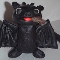 How To Train Your Dragon: Toothless I made this cake for a friend's daughter's birthday. Toothless is fondant with an inner structure of foil and toothpicks. I had...