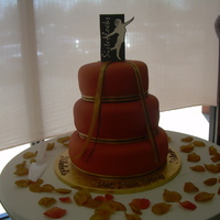 Sister Locks Book Siging This is a vanilla cake with buttercream icing and a burnt orange fondant overlay.