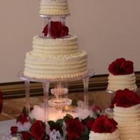 Red Roses Round Wedding Cake I did this cake for a friend. She picked it out of a Wilton book and wanted the entire look, table and all! There are 8 tiers total and...