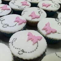 Butterfly Cupcakes Chocolate cupcakes covered with fondant, fondant accents and americolor pen used for marks