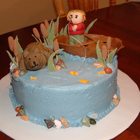 Wilderness Baby Shower Boat/boy/bear/ and leaves all gumpaste. Rocks are chocolate covered candies. Buttercream icing. I'm not a sculptor by nature, this was...