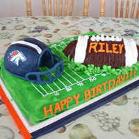 Football Birthday For my sons friend... he is a big bronco's fan. The helmet is ricecrispy and covered in fondant/gumpaste. All the rest is butter cream...